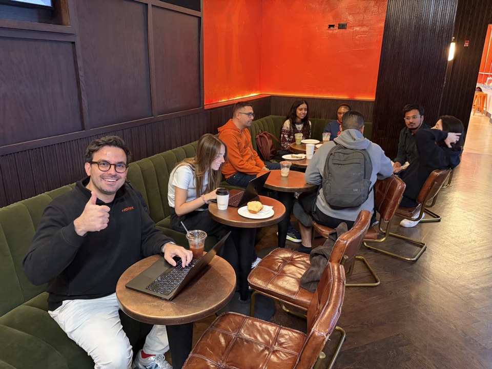 A group in the booth at AI Search Lab NYC